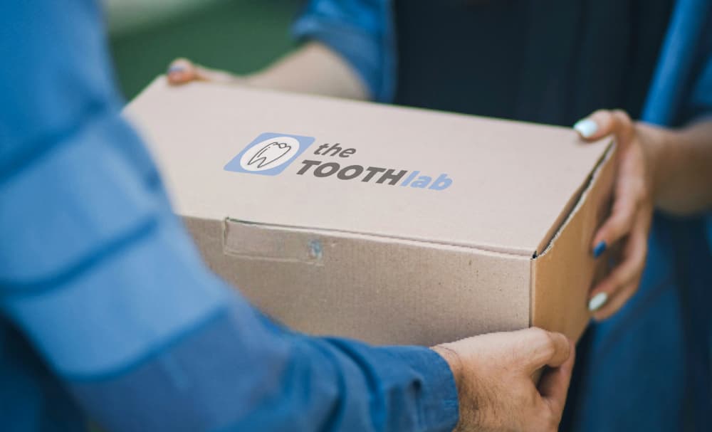 A Tooth Lab box being handed over for delivery